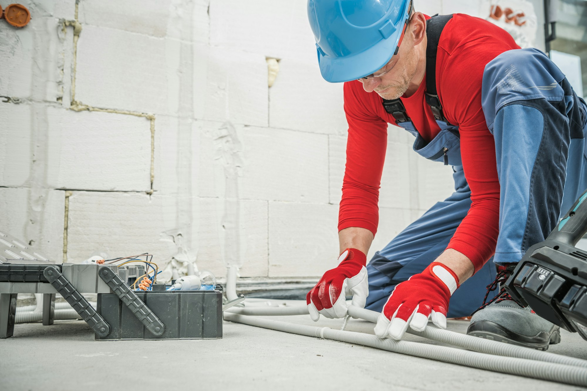 Electrician Working on Power Pipeline Installation